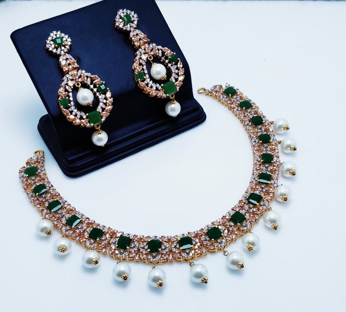 Gold Plated Necklace Set With jade champion Zircons and hanging Pearls.